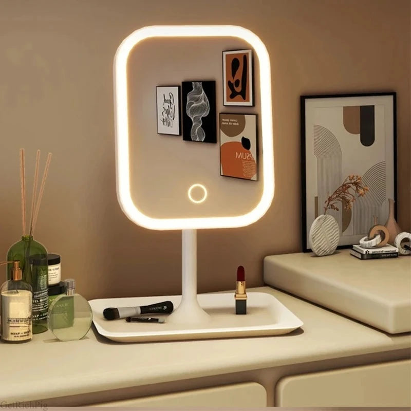 Espelho de mesa com iluminação LED, controle por toque e base organizadora, ideal para maquiagem, cuidados pessoais e decoração do quarto.